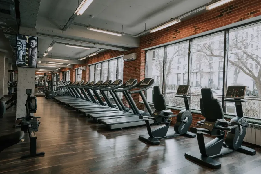 gym interior full of fitness equipment 