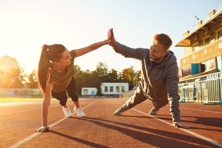 two people doing plank and high five