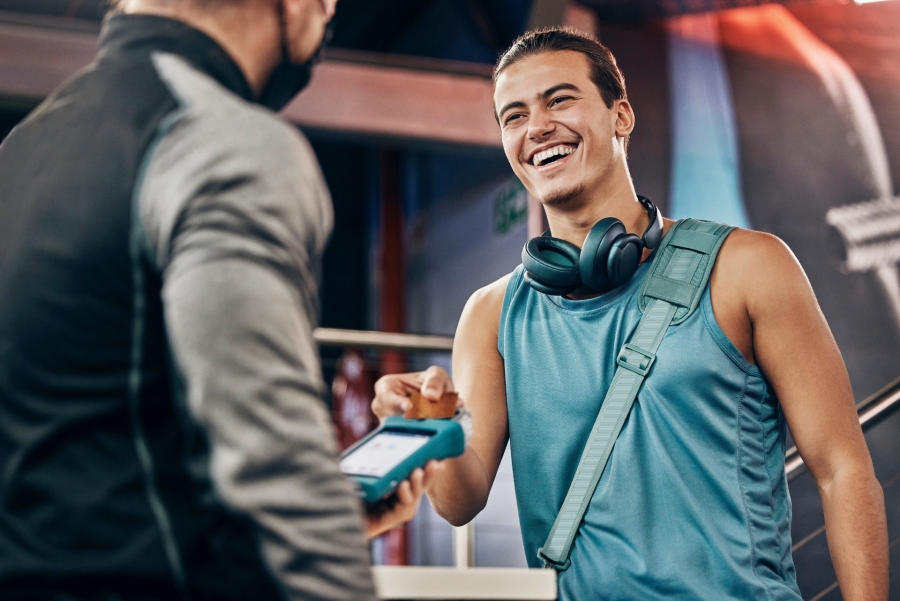 man paying card at the gym