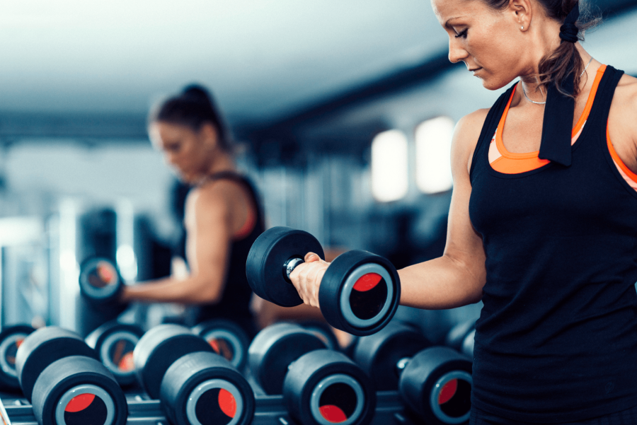 woman holding dumbbell